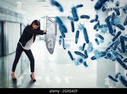 Rendu 3D. La femme protège avec le bouclier par une attaque de bactéries Banque D'Images