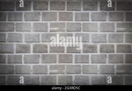 La texture rugueuse gros plan comme des briques, le mur en béton gris. Mise au point sélective Banque D'Images