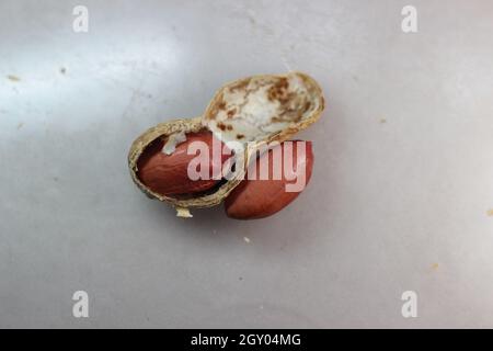 Arachides non pelées avec coquilles.Fond alimentaire des arachides Banque D'Images