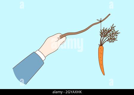 Notion de récompense et de punition de carotte et de bâton.Homme d'affaires main tenant Carrot sur le bâton pour manipuler, récompenser et faire la punition sur les travailleurs Banque D'Images
