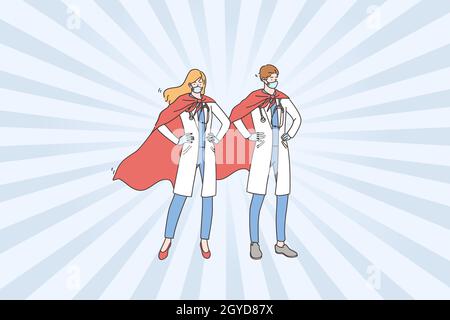 Les médecins sont les héros du concept COVID-10.Jeune couple homme et femme super médecins portant des masques médicaux et capes debout et se sentant con Banque D'Images