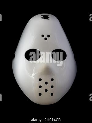 Masque de hockey blanc isolé du fond noir Banque D'Images