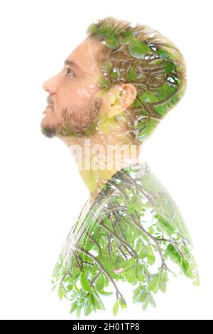 Un portrait de profil d'un jeune homme combiné à une plante tropicale dans une technique de double exposition Banque D'Images