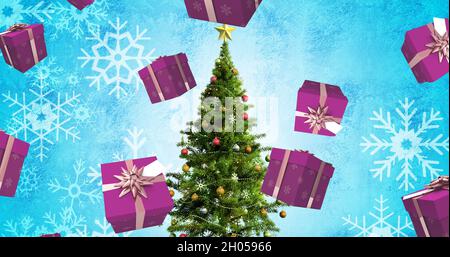Image de cadeaux tombant au-dessus de l'arbre de noël Banque D'Images