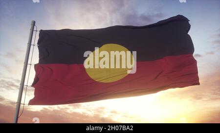 Australie drapeau aborigène qui agite dans le vent, le ciel et le soleil.3d rendu Banque D'Images