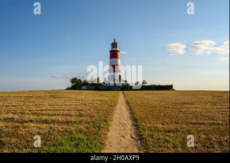 Le phare de Happisburgh est situé dans un domaine clos sur la côte nord de Norfolk, en Angleterre.C'est le plus ancien d'East Anglia. Banque D'Images