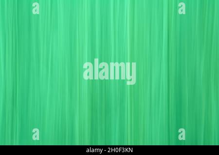 Mouvement abstrait arrière-plan flou avec lignes verticales en vert brillant