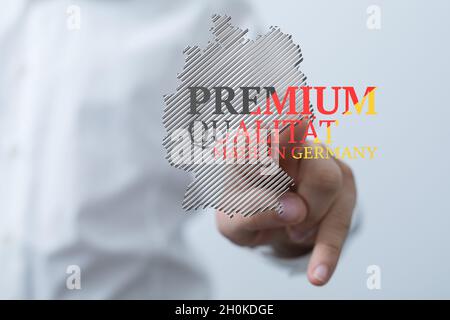 « Premium Quality, Made in Germany » écrit sur une silhouette de la carte de l'Allemagne Banque D'Images