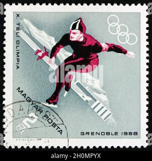 HONGRIE - VERS 1968 : un timbre imprimé en Hongrie montre le patinage de vitesse, le sport d'hiver, les 10 Jeux Olympiques d'hiver, Grenoble, vers 1968 Banque D'Images