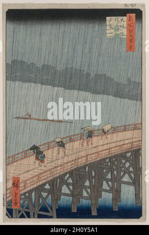 Douche soudaine sur le pont Shin-Ōhashi et ATake, de la série une centaine de vues célèbres d'Edo, 1857.Utagawa Hiroshige (japonais, 1797-1858).Impression en bois de couleur, encre et couleur sur papier; hors tout : 34.2 x 11.1 cm (13 7/16 x 4 3/8 po).Traversant Edo, le pont d'Ohashi était l'un des 300 ponts qui traversaient la rivière Sumida.Publié environ un an avant la mort de Hiroshige, cet imprimé illustre la maîtrise de l’artiste en matière de capture des conditions atmosphériques.Les personnages s'écurent à travers le pont au milieu de feuilles de pluie obliques. Banque D'Images