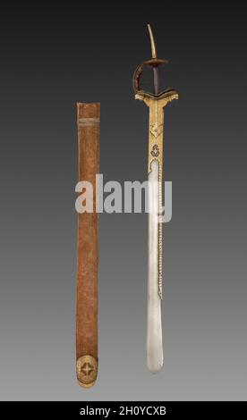 Épée avec fourreau, 1700s-1800s.L'Inde, peut-être Deccan.Lame en acier arrosé avec hilt en fer incrusté d'or; doublure en velours avec sangles en cuir; fourreau en bois avec étui en velours et fils métalliques; hors tout: 99 cm (39 in.).Les épées droites étaient typiques de celles utilisées dans les cercles militaires et aristocratiques dans les régions méridionales du Deccan, contrairement aux épées courbées favorisées par les équestriens d'Asie centrale.L'augmentation du contact entre le nord de Mughal et le sud du Deccan pendant les années 1600 a conduit à l'apparition de l'épée de style Deccan dans des portraits courtieusement réalisés pendant l'époque de Jahangi Banque D'Images