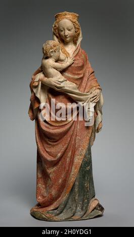 Virgin Nursing the Christ Child, c.1370. France, Île de France.Calcaire peint; hors tout: 111 x 38.5 cm (43 11/16 x 15 3/16 po).Cette sculpture de la Vierge Marie qui allaite l'enfant Christ met subtilement l'accent sur la relation intime entre la mère et l'enfant et rapproche le fils de Dieu dans son existence humaine du spectateur.L'interaction émotionnelle est caractéristique de la sculpture depuis le milieu des années 1300, surtout dans les cercles proches de la cour des rois de France à Paris et de l'empereur Charles IV (régné de 1346 à 78) à Prague.Ces nouvelles tendances stylistiques étaient peut-être une réaction à la TH Banque D'Images