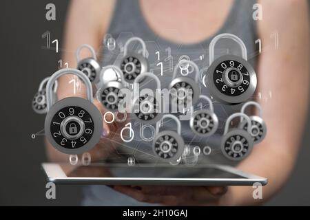 Rendu 3D des cadenas numériques flottant sur la main tenant le concept de cybersécurité des tablettes mobiles Banque D'Images