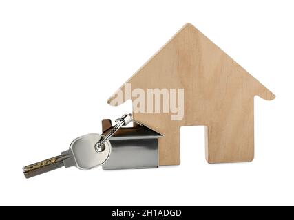 Touche d'accueil avec porte-clés et figure de maison en bois sur fond blanc Banque D'Images