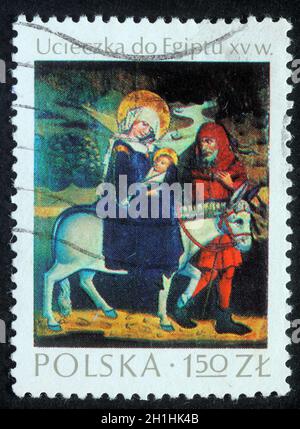 Le timbre de Noël imprimé en Pologne montre un vol vers l'Égypte, vers 1980 Banque D'Images