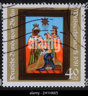 Le timbre de Noël imprimé en Allemagne montre la naissance de Jésus-Christ, adoration des Mages, vers 1981 Banque D'Images