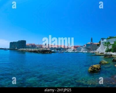 View through the fortress and marina in the old town of Dubrovnik, Croatia. Dubrovnik is a UNESCO World Heritage site Stock Photo