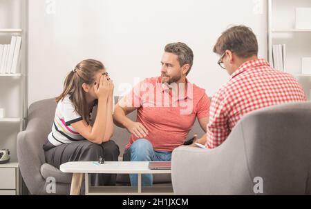 family aggression. man and woman talk to social worker. interpersonal relations. life coach. Stock Photo