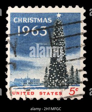 LE timbre-poste DE Noël AMÉRICAIN montre la Maison Blanche et le National Christmas Tree à Washington DC., vers 1963. Banque D'Images