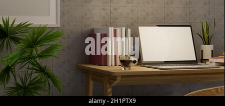 Poste de travail moderne avec ordinateur portable en maquette écran vierge et fournitures sur table en bois, maquette cadre poster sur mur en béton.rendu 3d, Banque D'Images