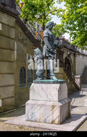 Bern, Switzerland - May 26, 2016: The bear, that is the city symbol, stands behind the founder of Bern, at Zahringer Denkmal Monument in Bern, Switzer Stock Photo