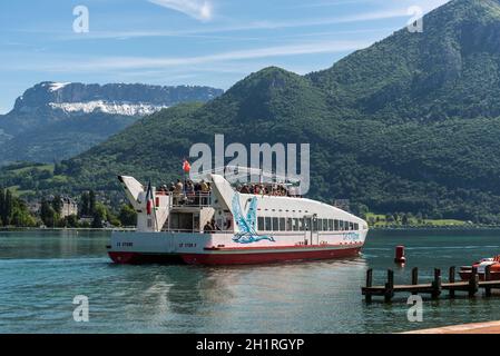 Annecy, France - May 25, 2016: Le Cygne catamaran trip boat on Annecy lake, Haute-Savoie, France. Stock Photo