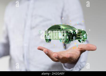 Rendu 3d de l'hologramme Electro-car flottant sur le concept d'e-motion de l'électromobilité de la main Banque D'Images