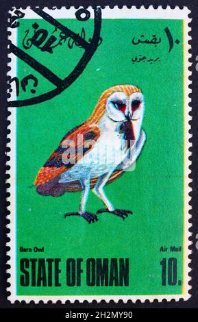 OMAN - VERS 1977 : un timbre imprimé dans l'État d'Oman montre la chouette de la grange, tyto alba, oiseau, vers 1977 Banque D'Images