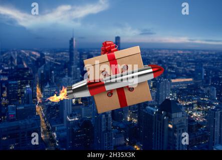 Le cadeau de Noël vole rapidement par une fusée au-dessus d'une ville Banque D'Images