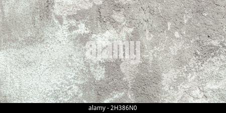 Mur en plâtre gris avec fond de texture en stuc gris pelable.Surface murale abstraite grossière fissurée et décadée Banque D'Images