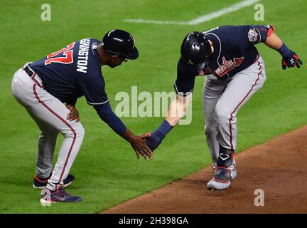 FILE ** Tennessee Titans linebacker Keith Bulluck (53) and safety Lamont  Thompson (28) stop Houston Texans running back Domanick Davis (37) during  the Texans' 20-10 win over the Titans on Sunday