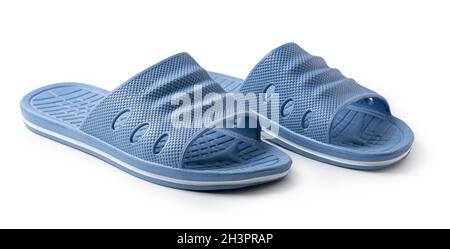 Chaussons en caoutchouc bleu sur fond blanc Banque D'Images