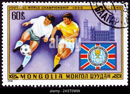 MONGOLIE - VERS 1978: Un timbre imprimé en Mongolie montre la scène de football, le Parlement et Big Ben, Londres, 11e Championnat du monde de football, Argentine, Banque D'Images