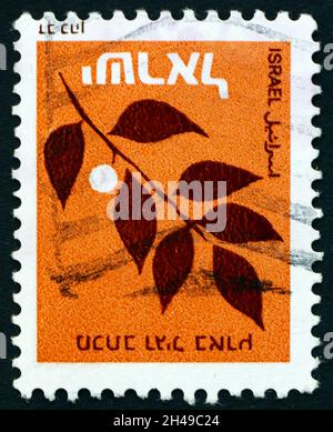 ISRAËL - VERS 1982 : un timbre imprimé en Israël montre une branche d'olivier, vers 1982 Banque D'Images