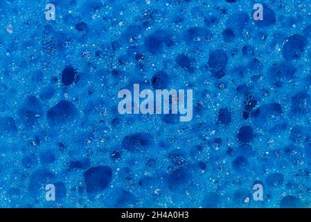 La texture éponge en mousse se rapproche de l'arrière-plan Banque D'Images