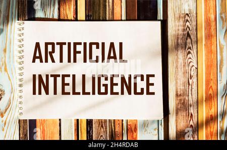 Bloc-notes avec texte intelligence artificielle sur fond rayé Banque D'Images