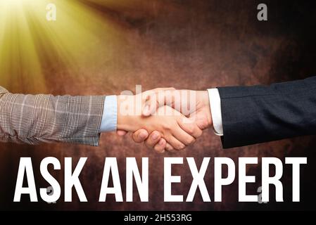 Légende de la présentation Demandez à un expert.Confirmation conceptuelle de photo qui ont lu comprendre et d'accord avec les directives deux professionnels bien habillés Banque D'Images