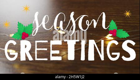 Image du texte de voeux de la saison sur les lumières de noël Banque D'Images