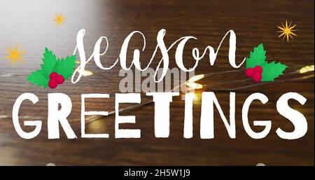 Image du texte de voeux de la saison sur les lumières de noël Banque D'Images