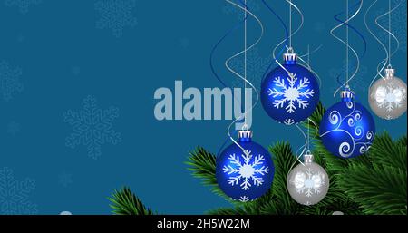 Image de boules de noël sur la neige tombant Banque D'Images