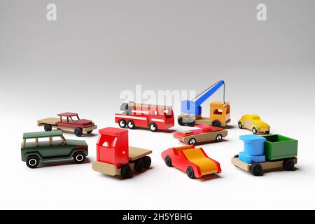 illustration 3d des jouets pour enfants d'une voiture multicolore, jeep, convertible, camion à benne basculante, camion et grue sur un fond blanc isolé.Jouet écologique pour Banque D'Images