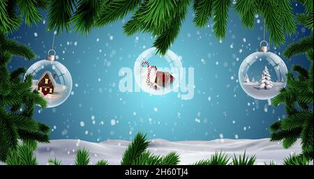 Image de sapins et de boules de noël sur la chute de neige Banque D'Images