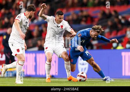 Londres, Royaume-Uni.12 novembre 2021.Jack Grealish d'Angleterre est fouillé par Odise Roshi d'Albanie lors du match de qualification I de la coupe du monde de la FIFA 2022 entre l'Angleterre et l'Albanie au stade Wembley le 12 novembre 2021 à Londres, en Angleterre.(Photo de Daniel Chesterton/phcimages.com) Credit: PHC Images/Alamy Live News Banque D'Images