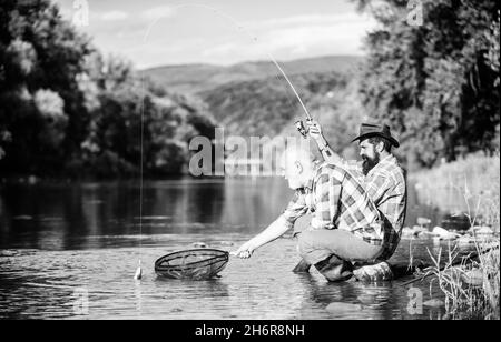 Old Man Fishing with Little Boy