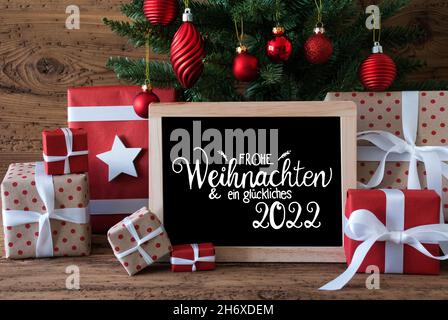 Sapin De Noël, Cadeau, Texte Glueckliches 2022 Signifie Happy 2022, Flocons De Neige Photo Stock - Alamy