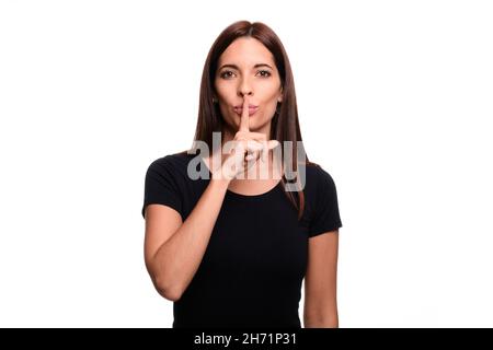 Isolé dans fond blanc une femme brunette disant fermé en espagnol signe langue Banque D'Images