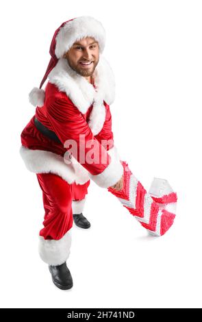 Père Noël avec pinata de canne à sucre sur fond blanc Banque D'Images