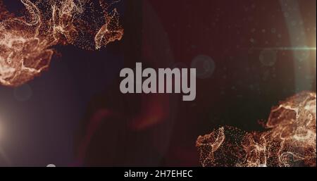 Image des particules orange et des lumières de bokeh se déplaçant sur un arrière-plan sombre Banque D'Images