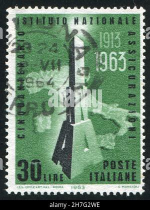 ITALIE - VERS 1963: Timbre imprimé par l'Italie, montre la carte de l'Italie et les initiales de l'INA, vers 1963 Banque D'Images