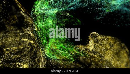 Image de nuages de particules verts et jaunes se déplaçant sur fond noir Banque D'Images